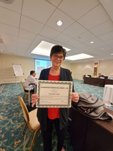 Liz Casper with her certificate 2021